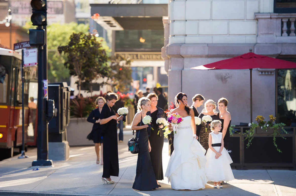 Sunlit photo of bride & bridesmaids outside the Blackstone Hotel Chicago.