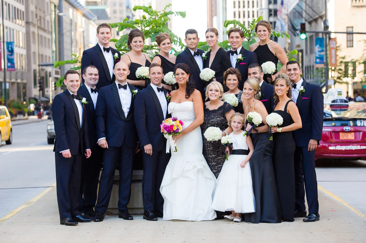 Bridal party photo on median of Michigan Avenue near the Wrigley Building. 