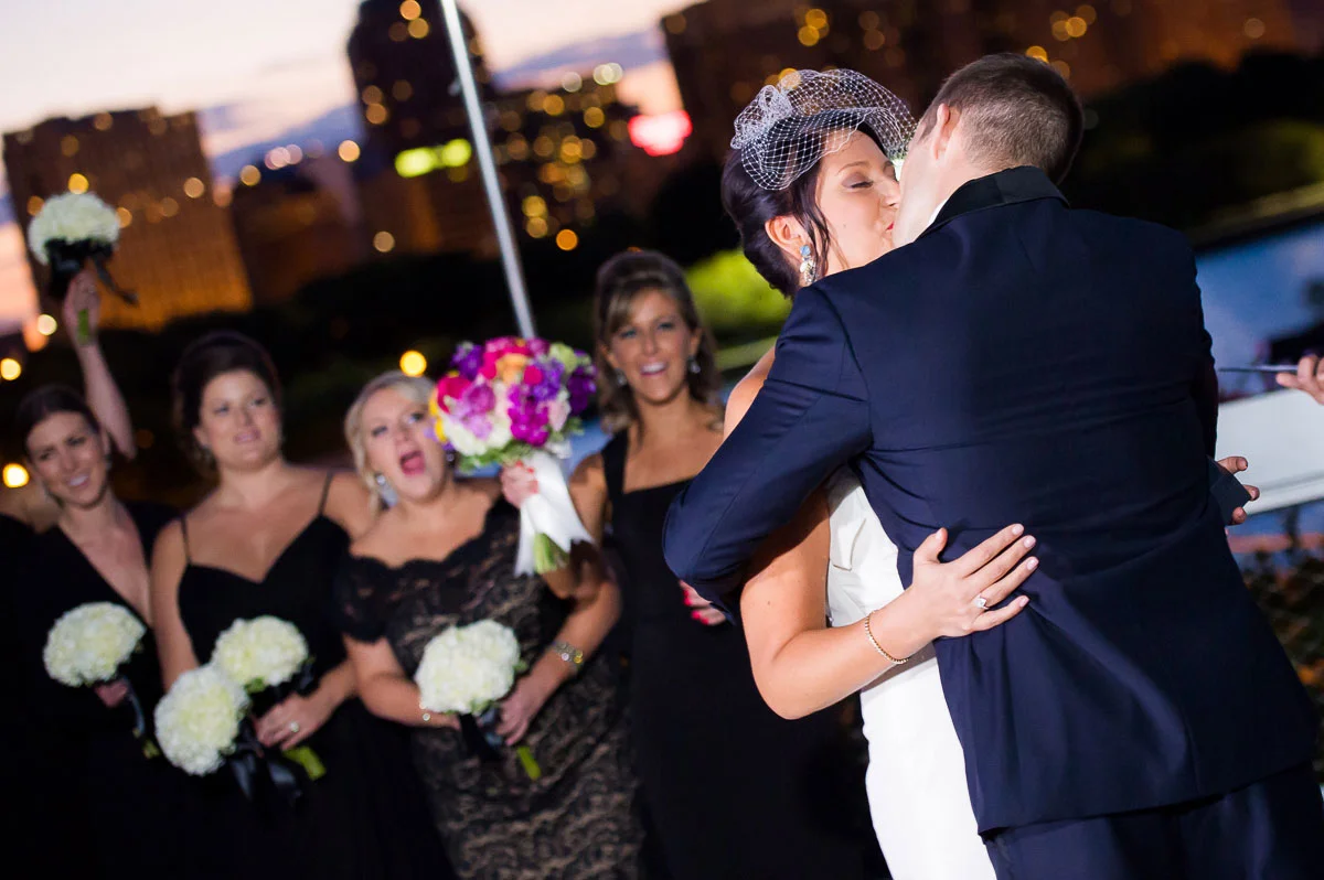 Couple's first kiss as husband & wife at the Shedd Aquarium Chicago. 
