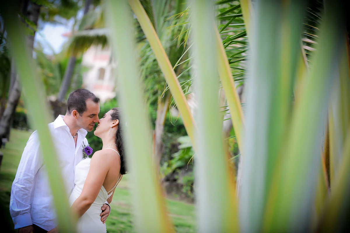 A couple's kiss during a destination wedding at the Majestic Colonial Resort, Punta Cana. 