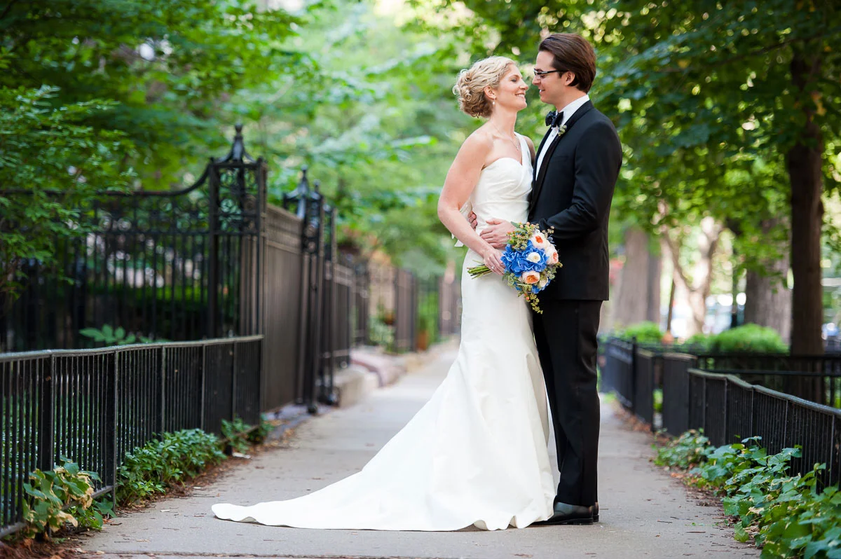 Bride & groom embrace on their wedding day in Chicago's Gold Coast.
