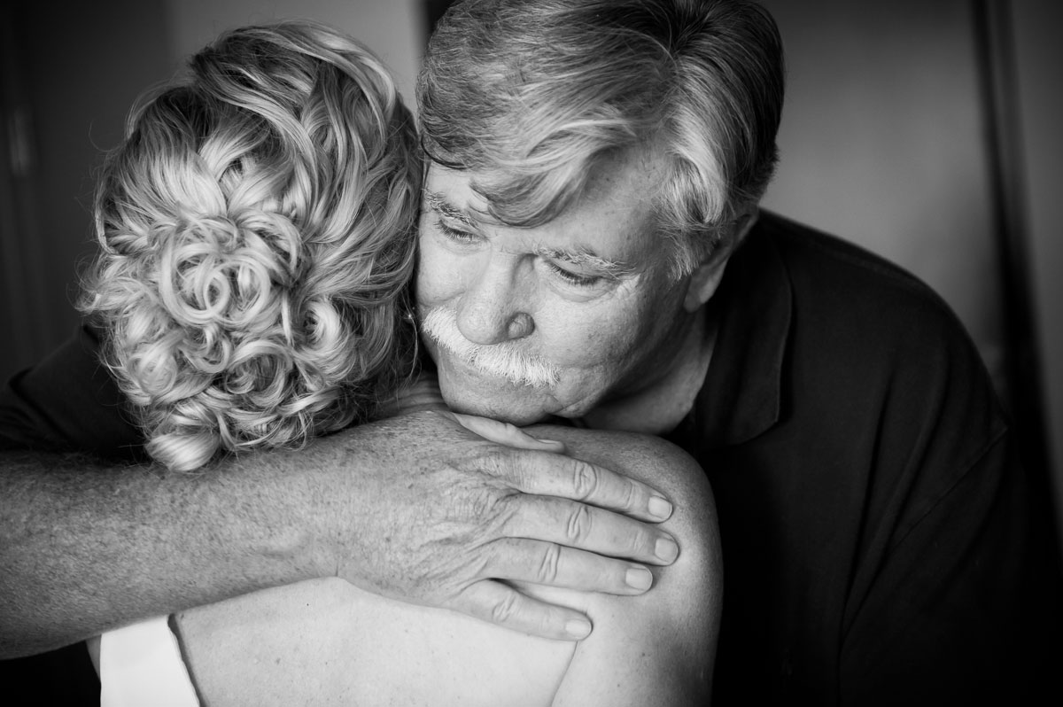 The father-of-the-bride hugs his daughter before her wedding at the Thompson Chicago Hotel. 
