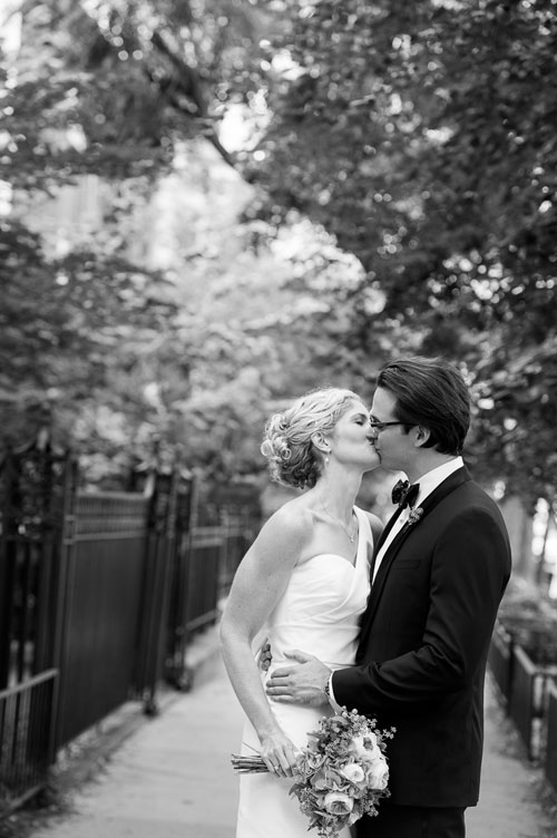 Couple embraces on their wedding day in Chicago's Gold Coast. 
