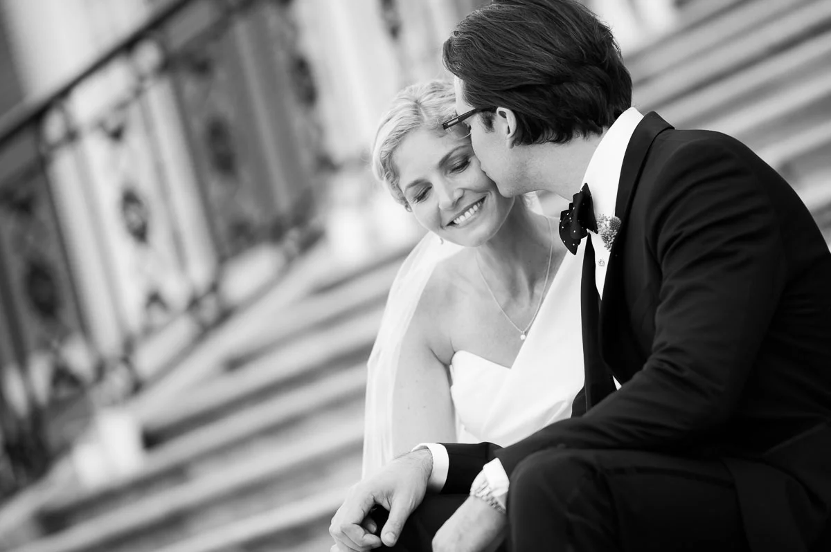 Bride & groom share a tender moment on the steps of the Chicago History Museum. 