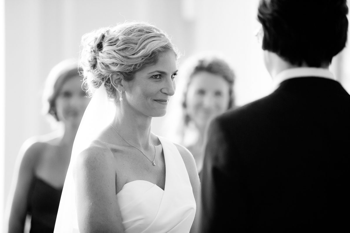 Bride gazes into her groom's eyes during their wedding ceremony at the Chicago History Museum. 