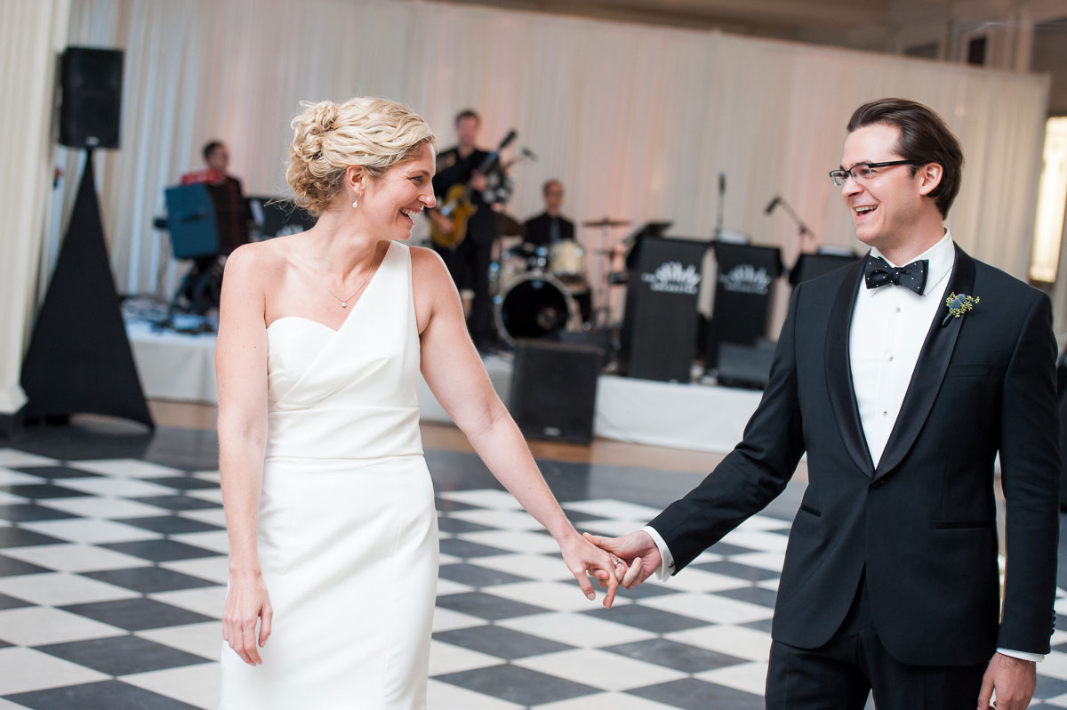 Bride & groom make an entrance during their wedding reception at the Chicago History Museum. 