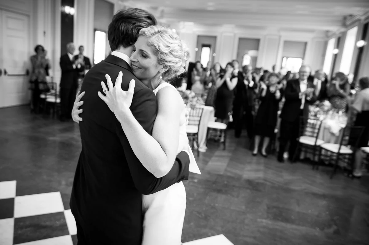 Bride & groom embrace during their first dance at a Chicago History Museum wedding reception. 
