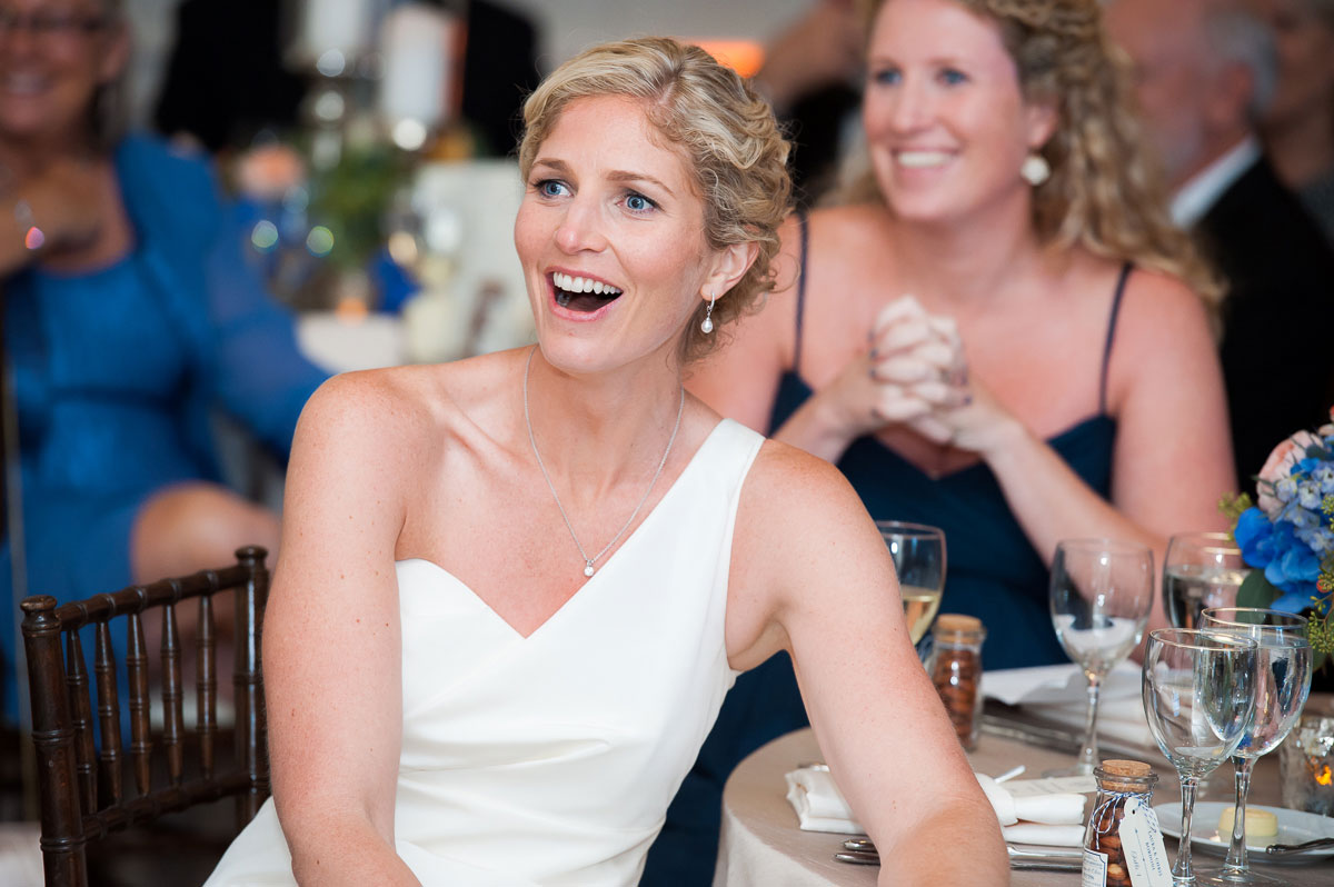 Bride reacts to her father's speech during her wedding reception at the Chicago History Museum. 