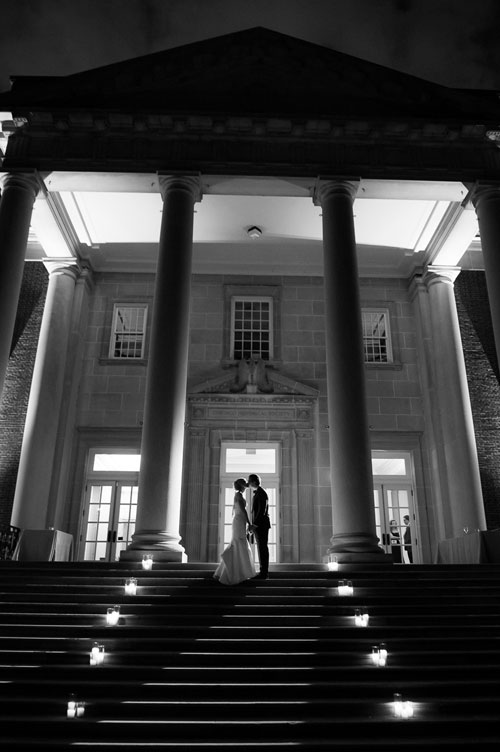 Creative night portrait of the bride & groom on the steps of the Chicago History Museum. 