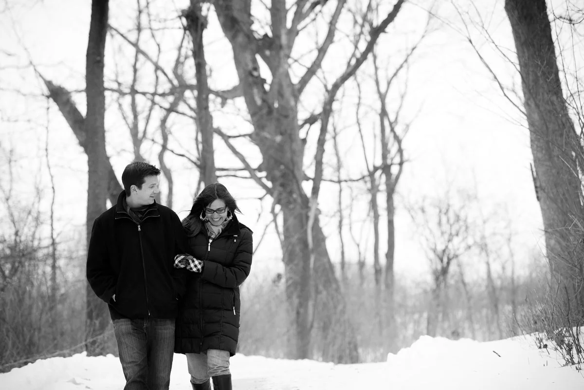 Couple takes a casual winter-time walk through Deicke Park during their engagement session. 