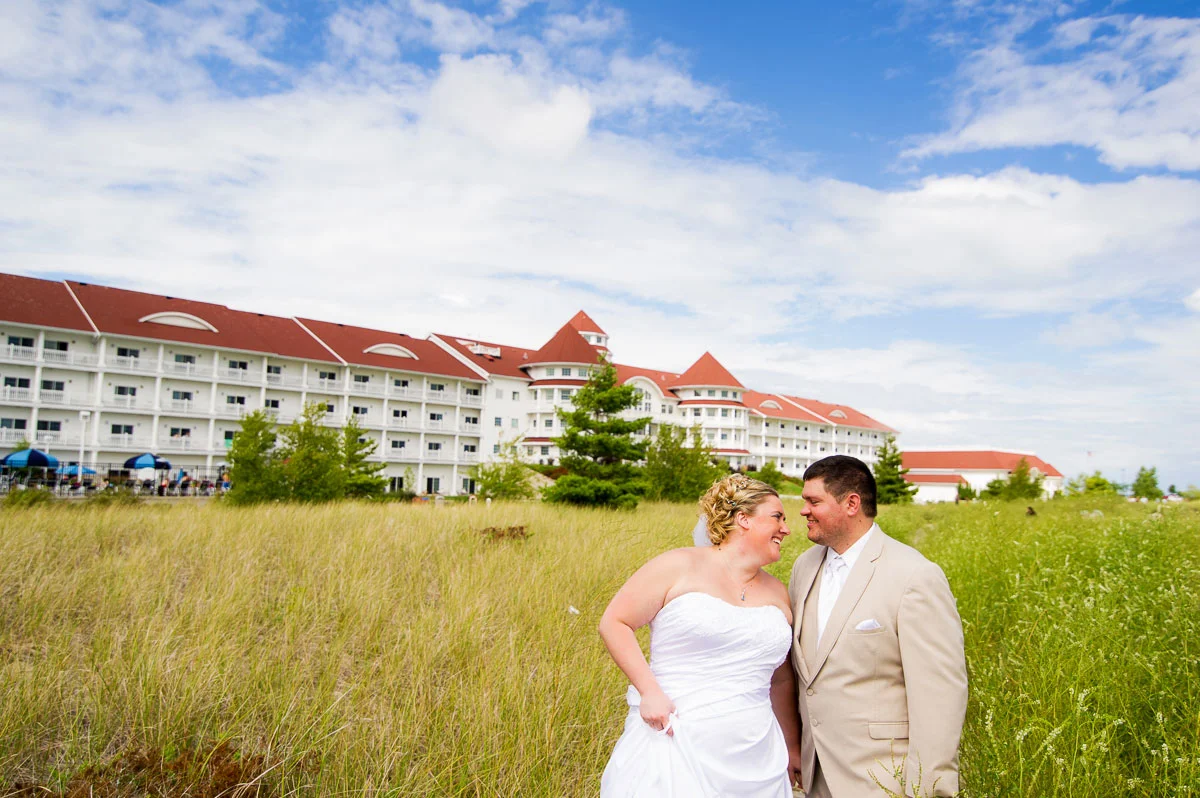 Bride & groom share a laugh on their wedding day at Blue Harbor Resort in Sheboygan, Wisconsin.