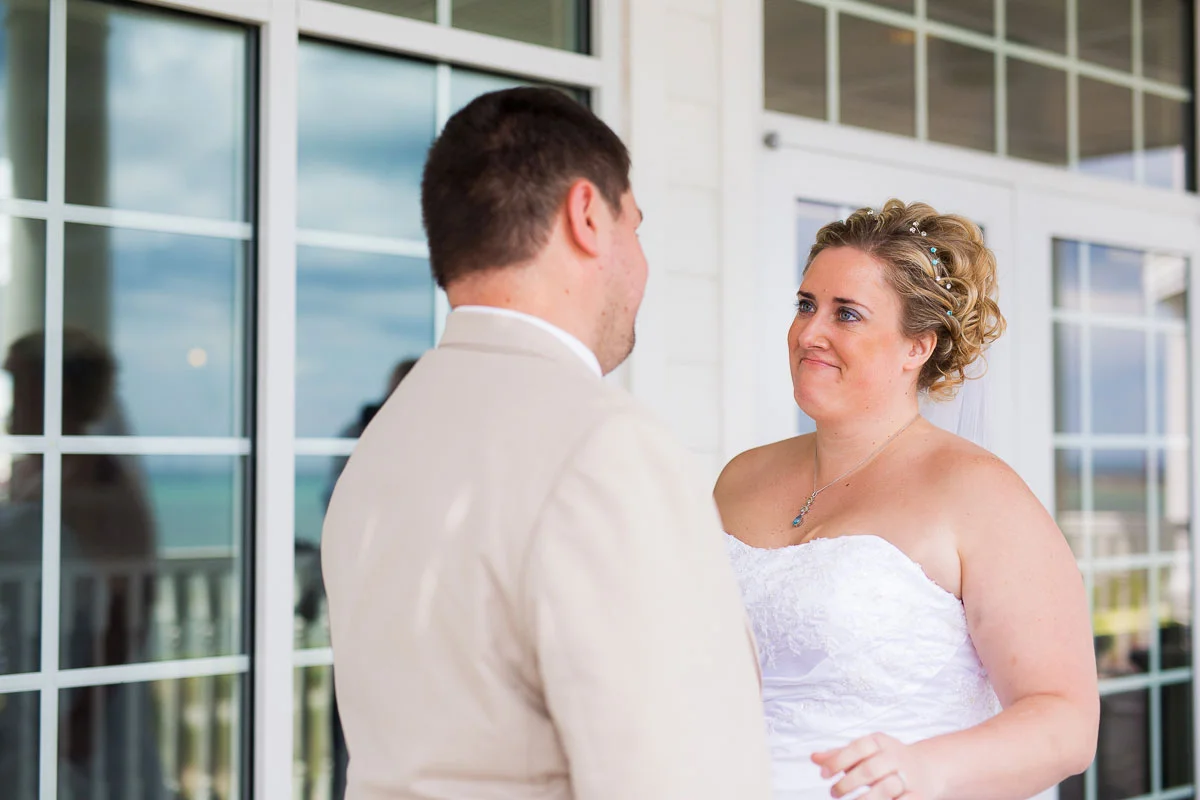 The couple's "first look" on a balcony at Blue Harbor Resort in Sheboygan, Wisconsin. 