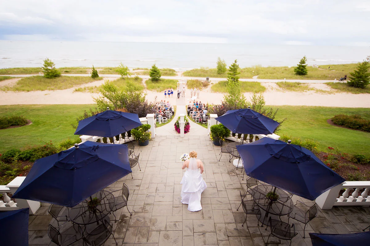 Bride walks down the aisle during her wedding at Blue Harbor Resort.
