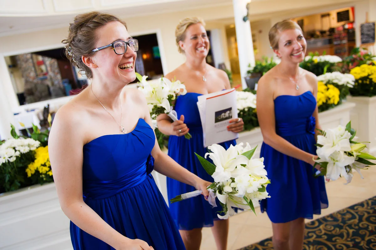 The bridesmaids can hardly contain their excitement after a wedding ceremony at Blue Harbor Resort in Sheboygan, Wisconsin. 
