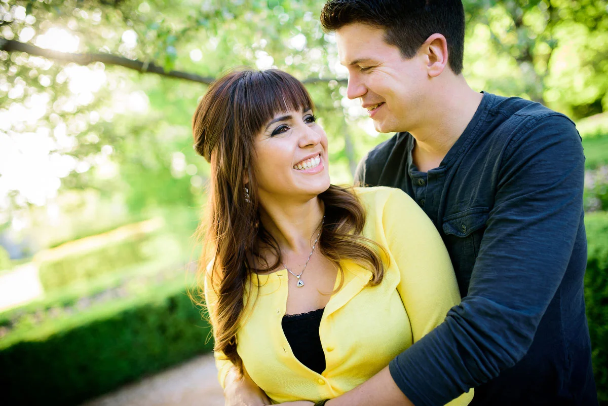 Couple embraces during their engagement session at the Morton Arboretum in Lisle, IL. 