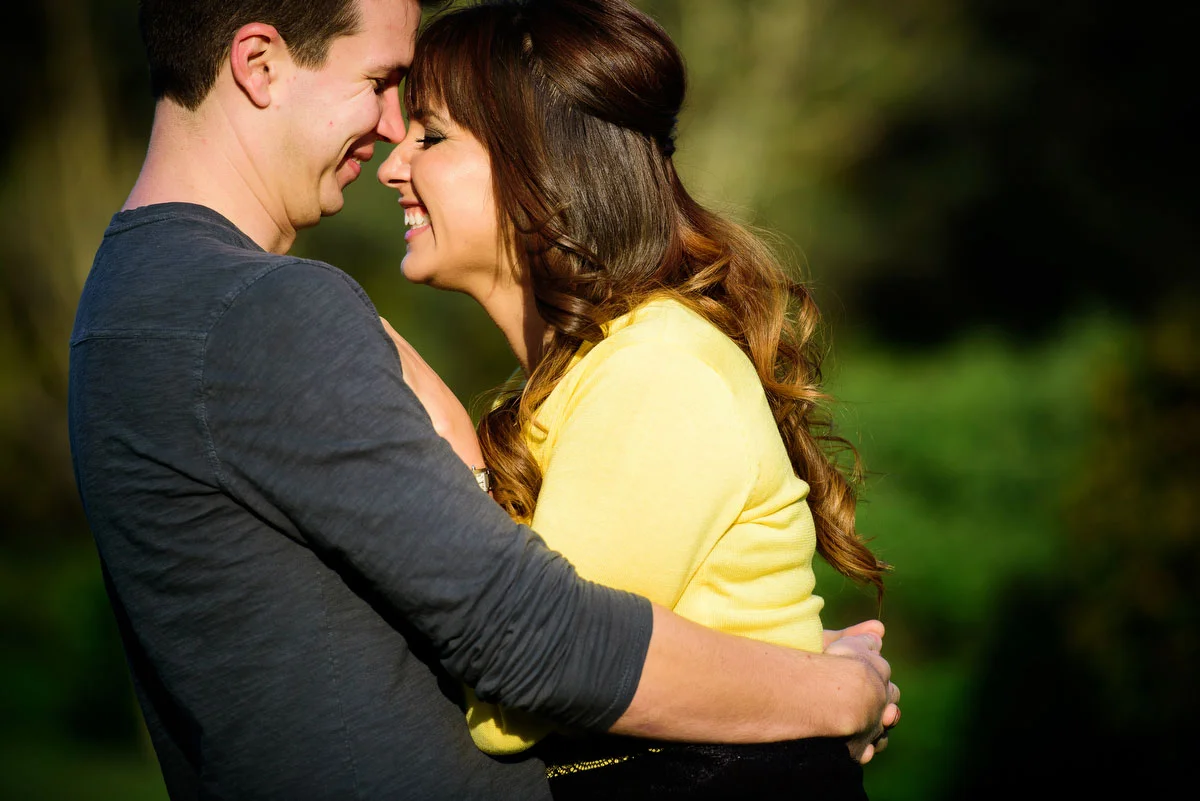 Couple embraces during their engagement session at the Morton Arboretum in Lisle, IL. 