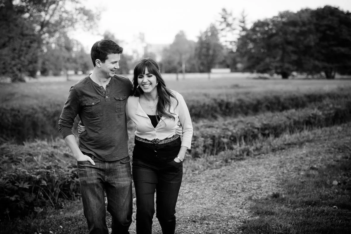 A couple takes a walk during their engagement session at the Morton Arboretum in Lisle, IL. 