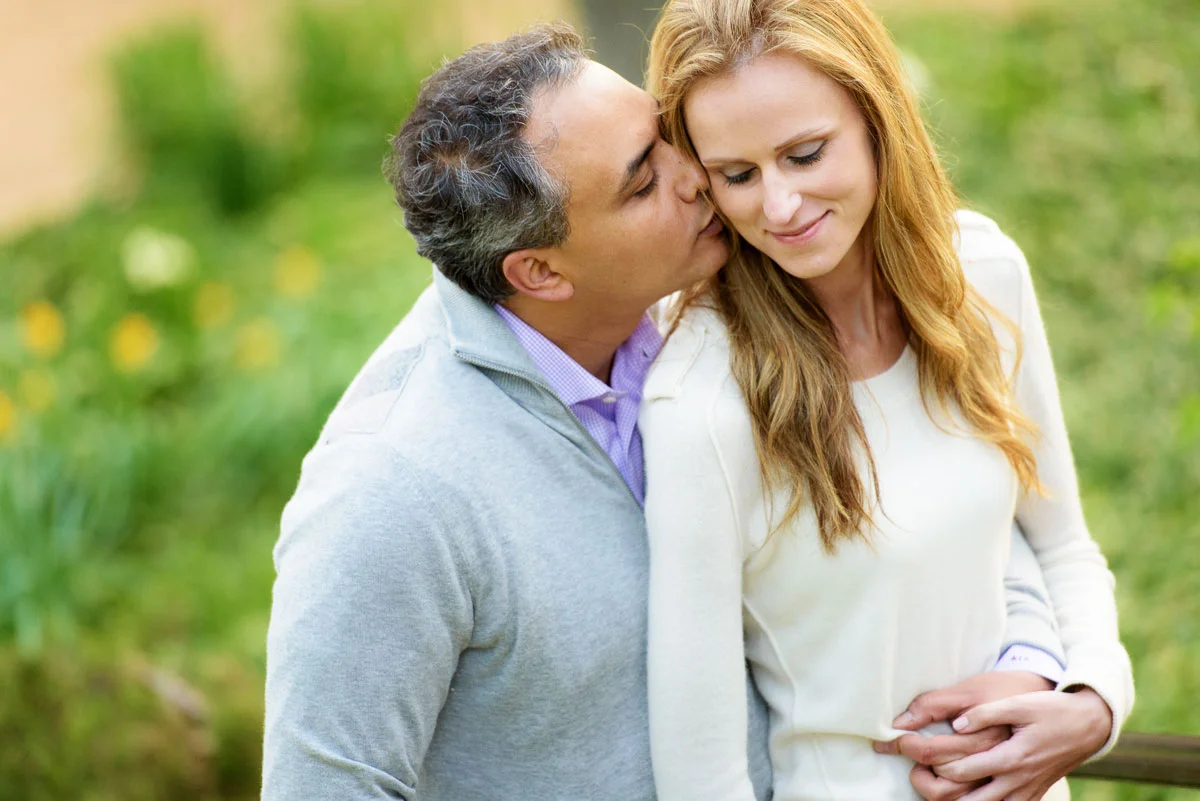 Couple embraces during their engagement session at the Chicago Botanic Gardens.