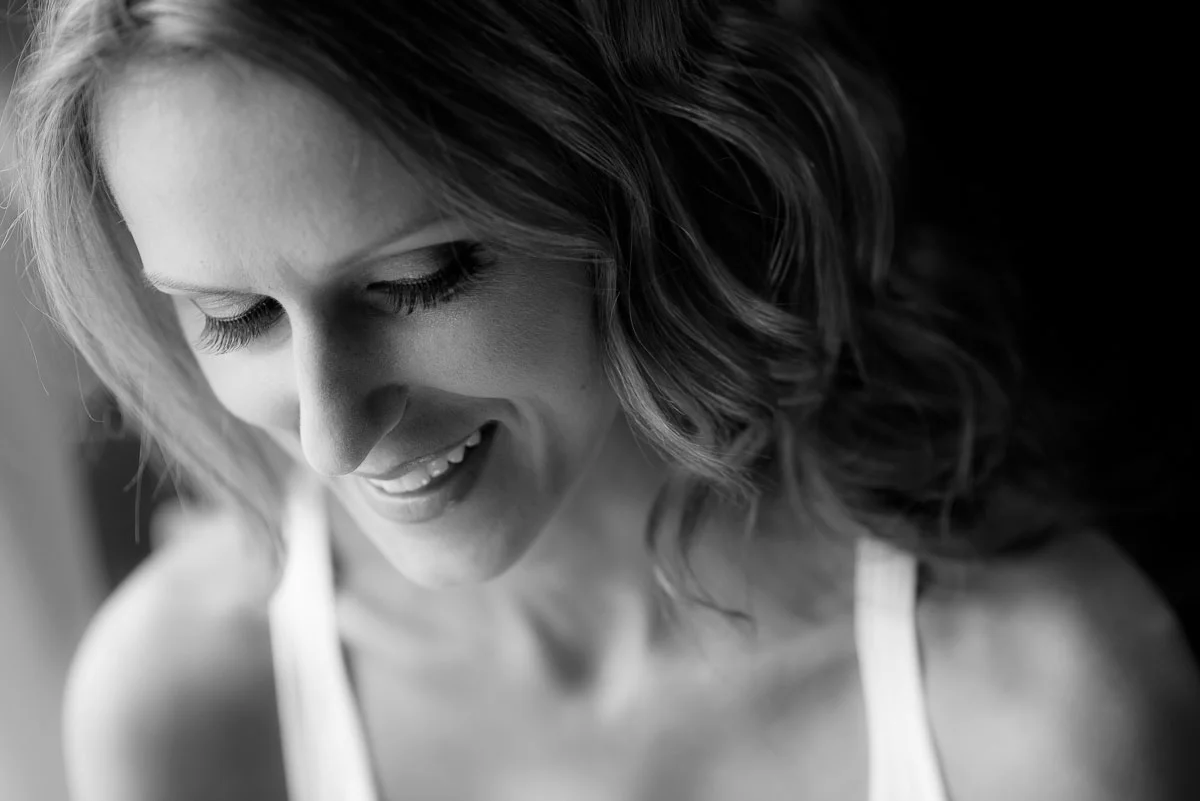 Bride has her makeup done at the Trump Tower Chicago before her wedding. 