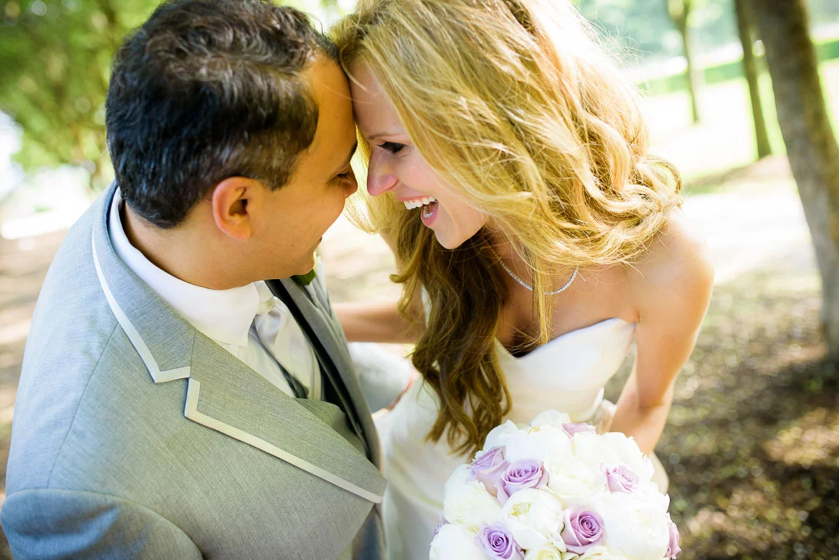 Bride & Groom share a fun moment together during their wedding photos in Grant Park Chicago. 