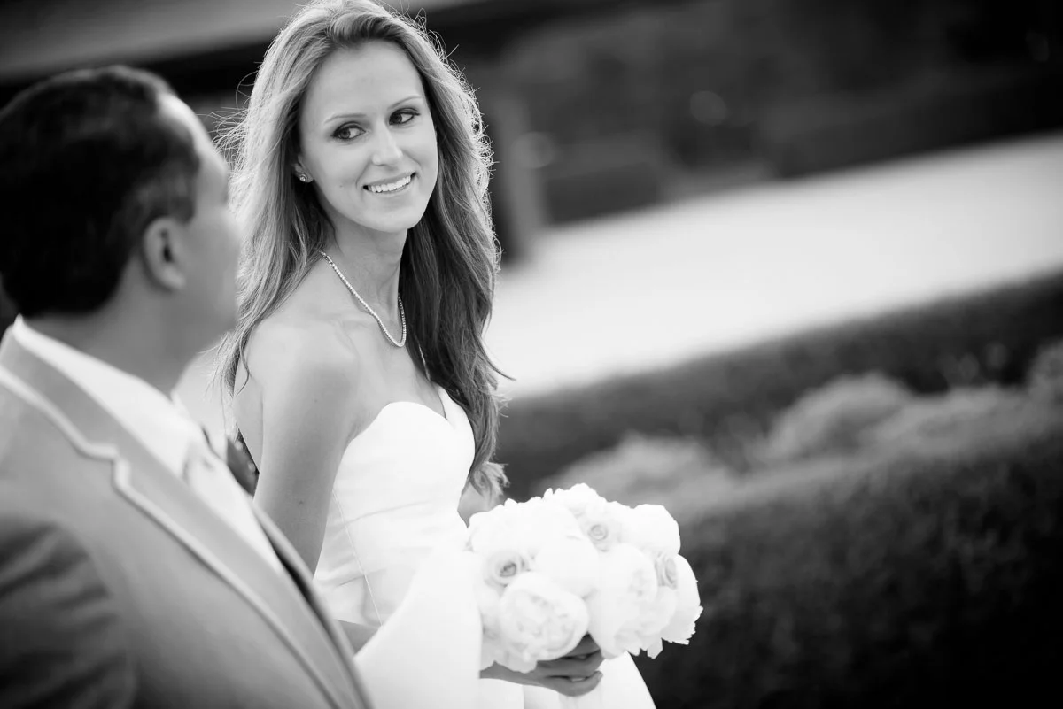 Bride and groom take a walk together during their wedding photos at the Tiffany Gardens in Chicago. 