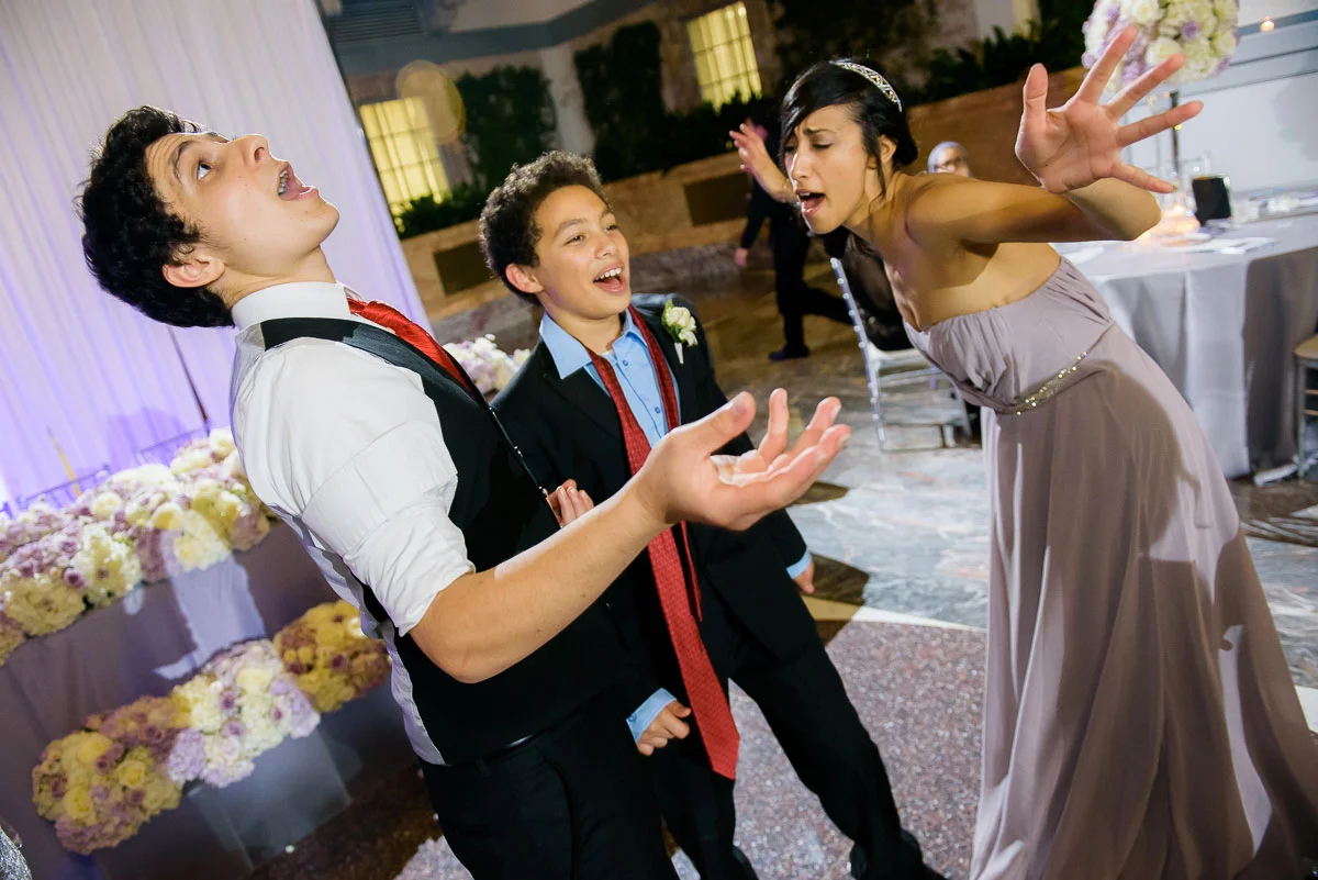 Kids have fun dancing during a wedding reception at the Winter Garden in the Harold Washington Library Chicago. 