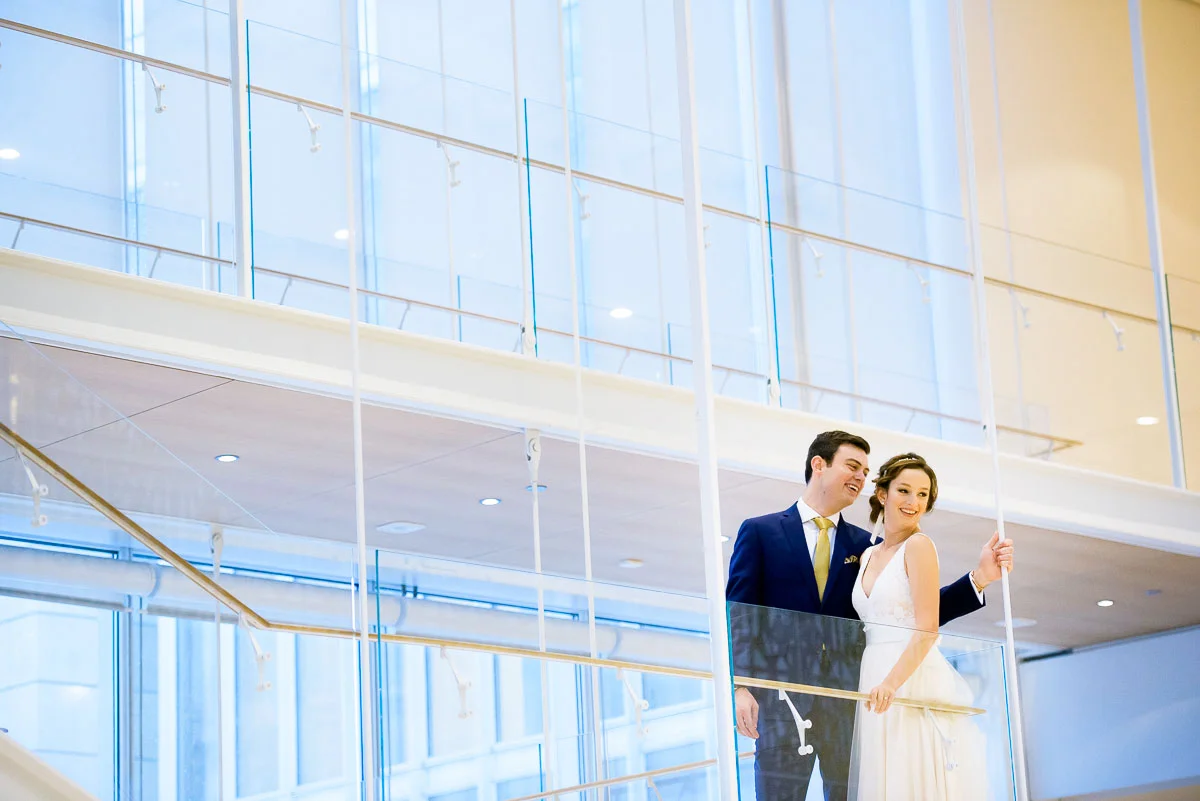 Bride & groom share a moment with their bridal party during the wedding day at the Art Institute of Chicago. 