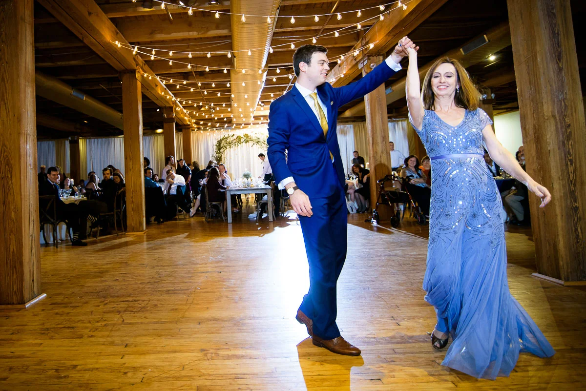 The groom and his mother dance at his Bridgeport Arts Center wedding. 