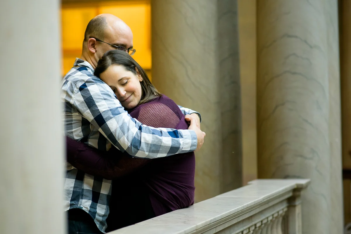 Couple embraces during their engagement session at the Art Institute of Chicago. 
