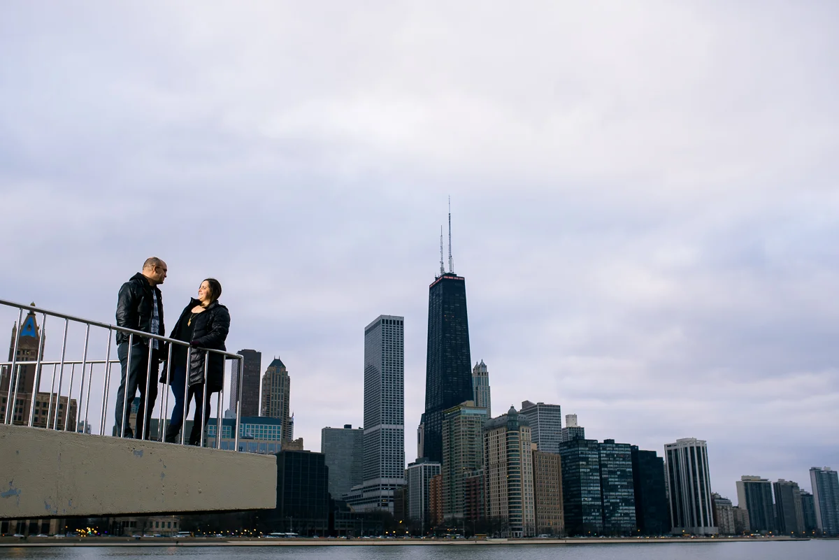 Engagement photo of the couple against the Chicago skyline. 