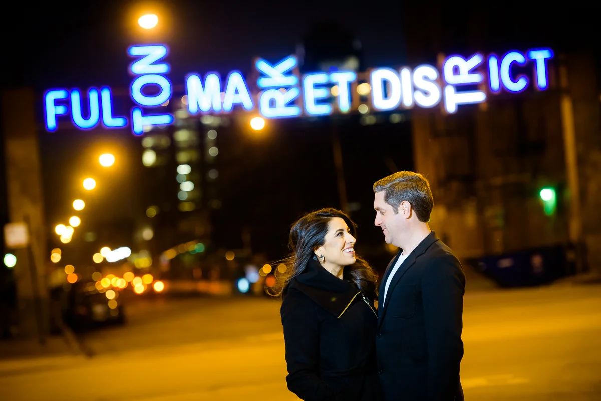 Night portrait in Fulton Market of the couple during their Chicago engagement session.
