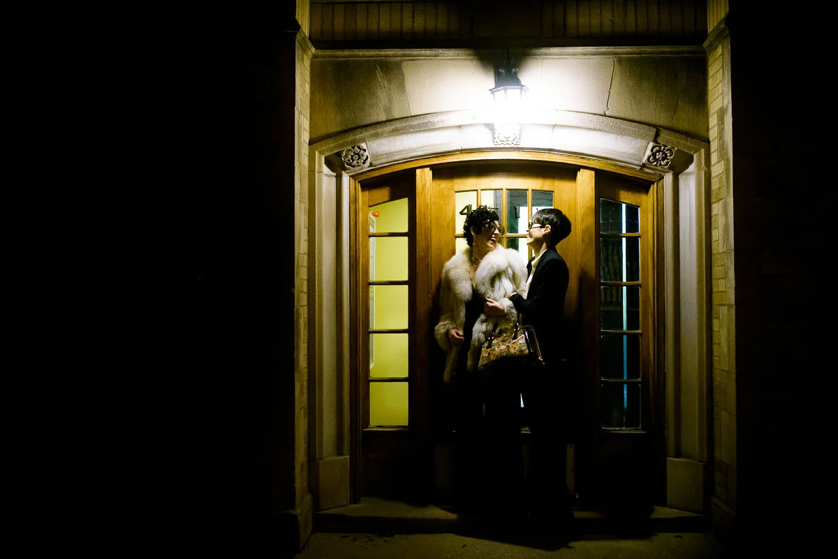 Same sex couple wedding night portrait outside their Lincoln Square apartment. 