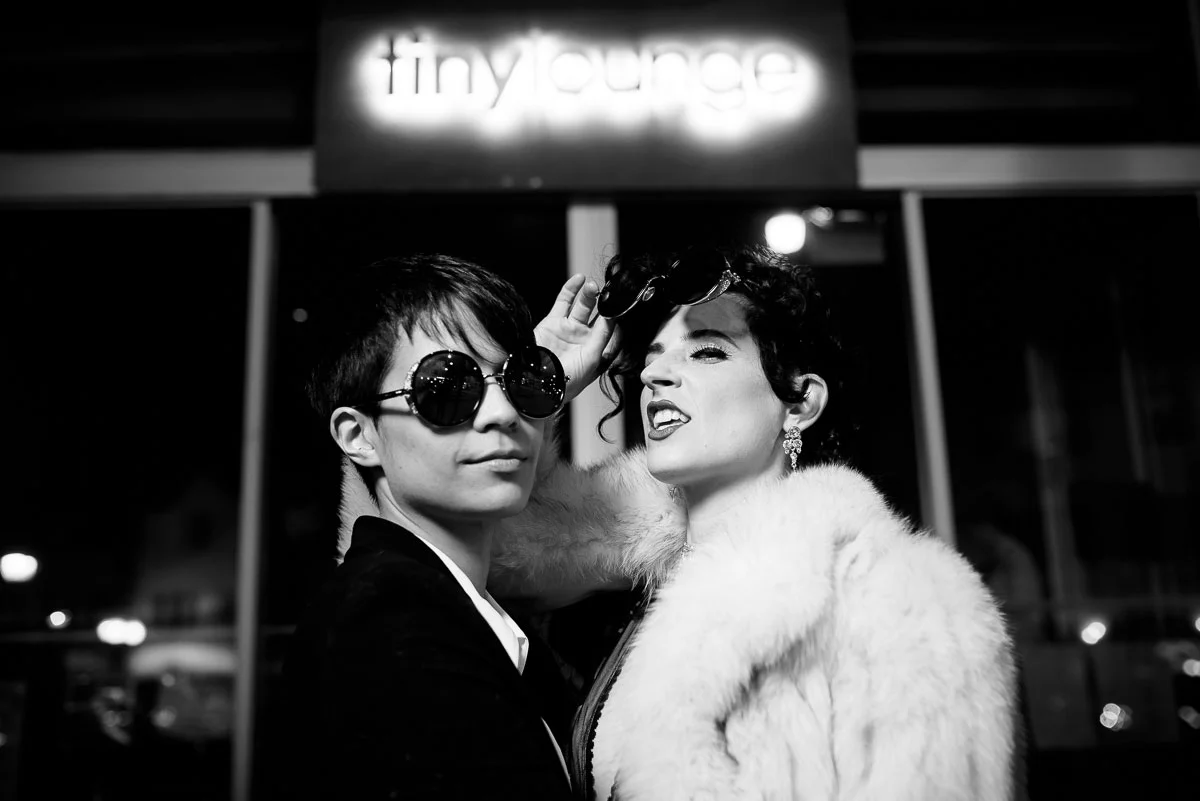 Same sex couple outside Tiny Lounge on their wedding day. 
