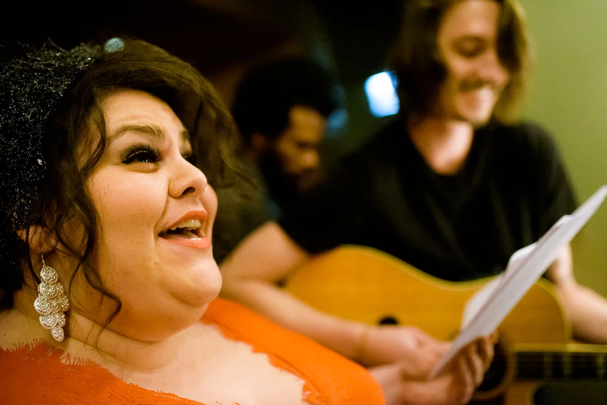 Musicians play during a same sex wedding ceremony at Tiny Lounge. 