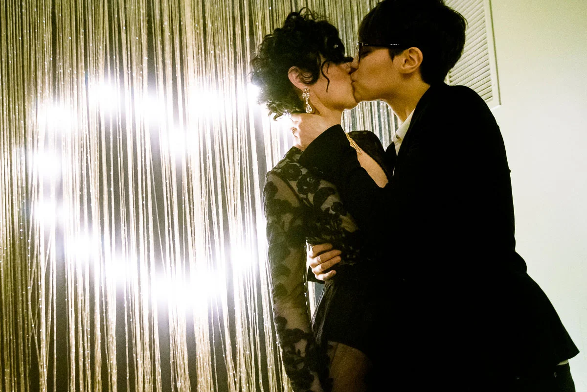 Same sex couple's first kiss during their wedding ceremony at Tiny Lounge. 