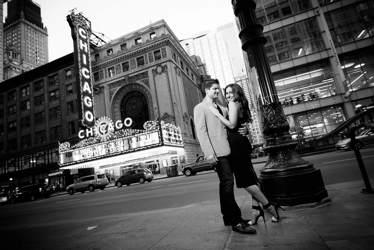 Engagement session outside the Chicago Theater at sunset. 