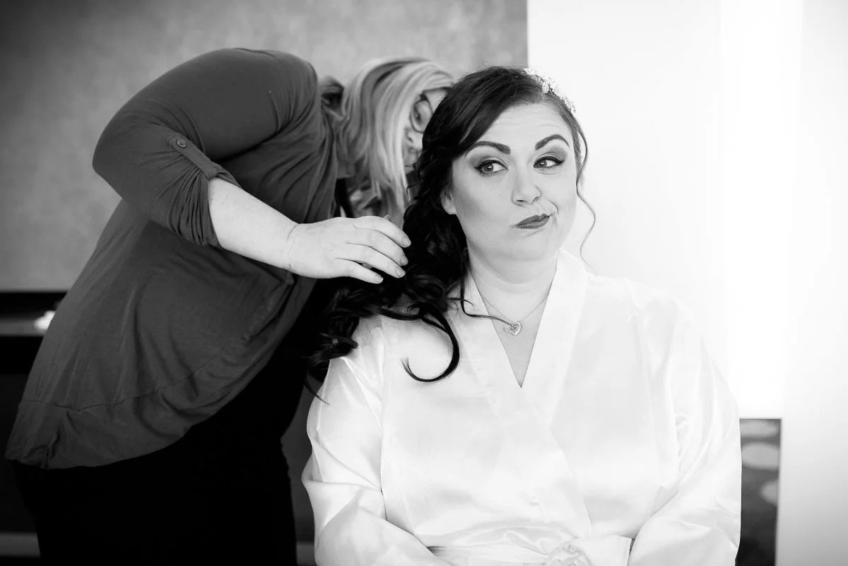 Bride goofs off while getting ready at the Sofitel Chicago.