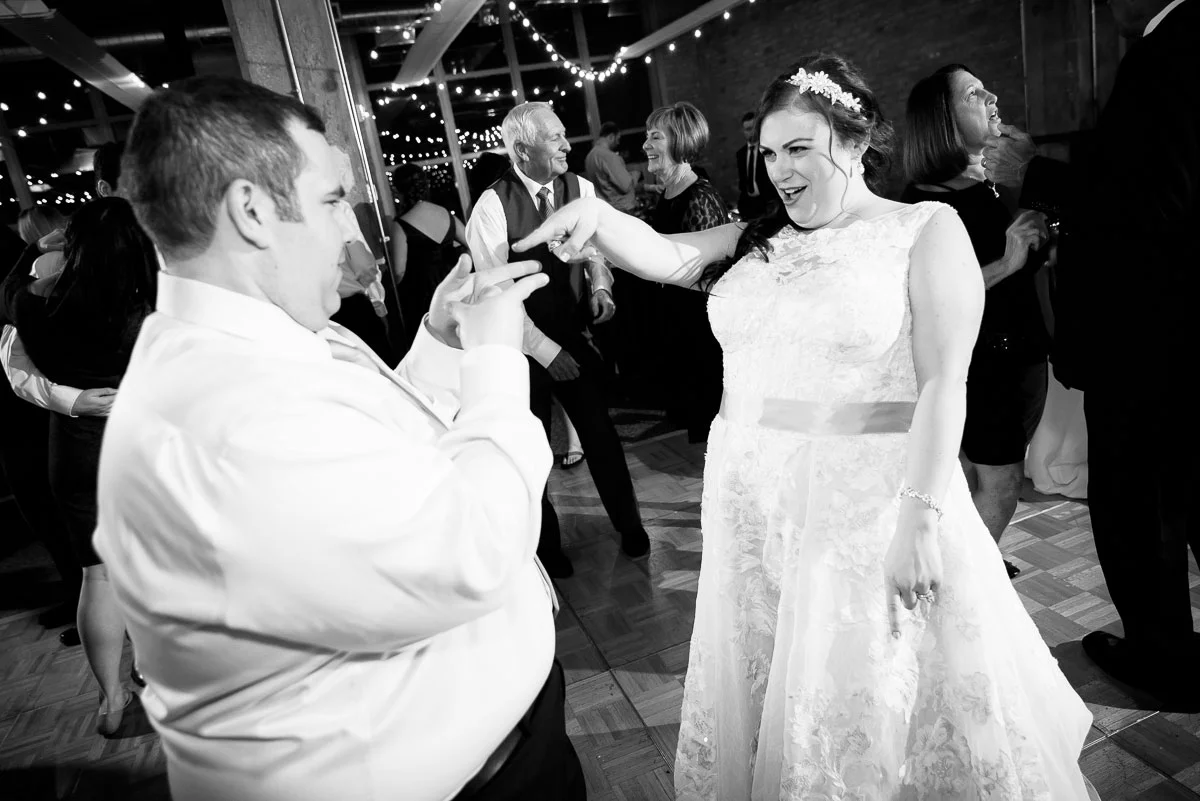 Bride & groom having fun on their wedding day at Kendall College Chicago. 