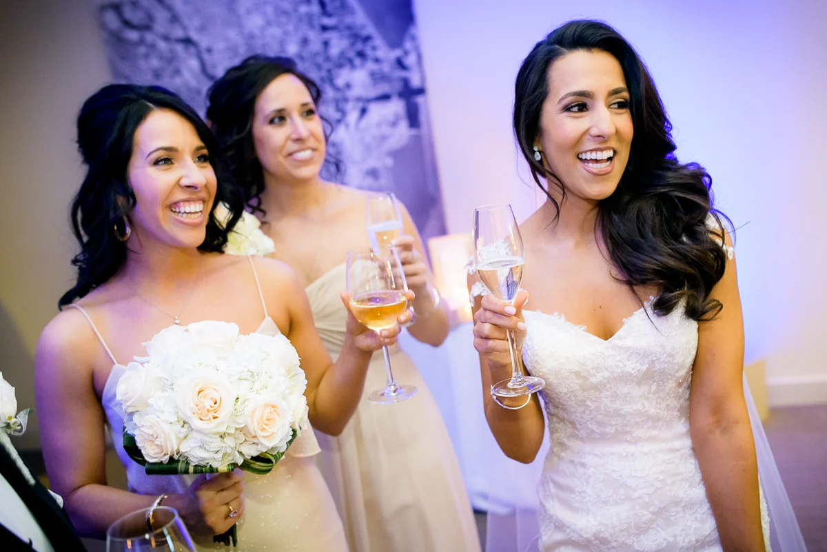 Bride shares a moment with her bridesmaid just after her Thompson Chicago wedding ceremony.