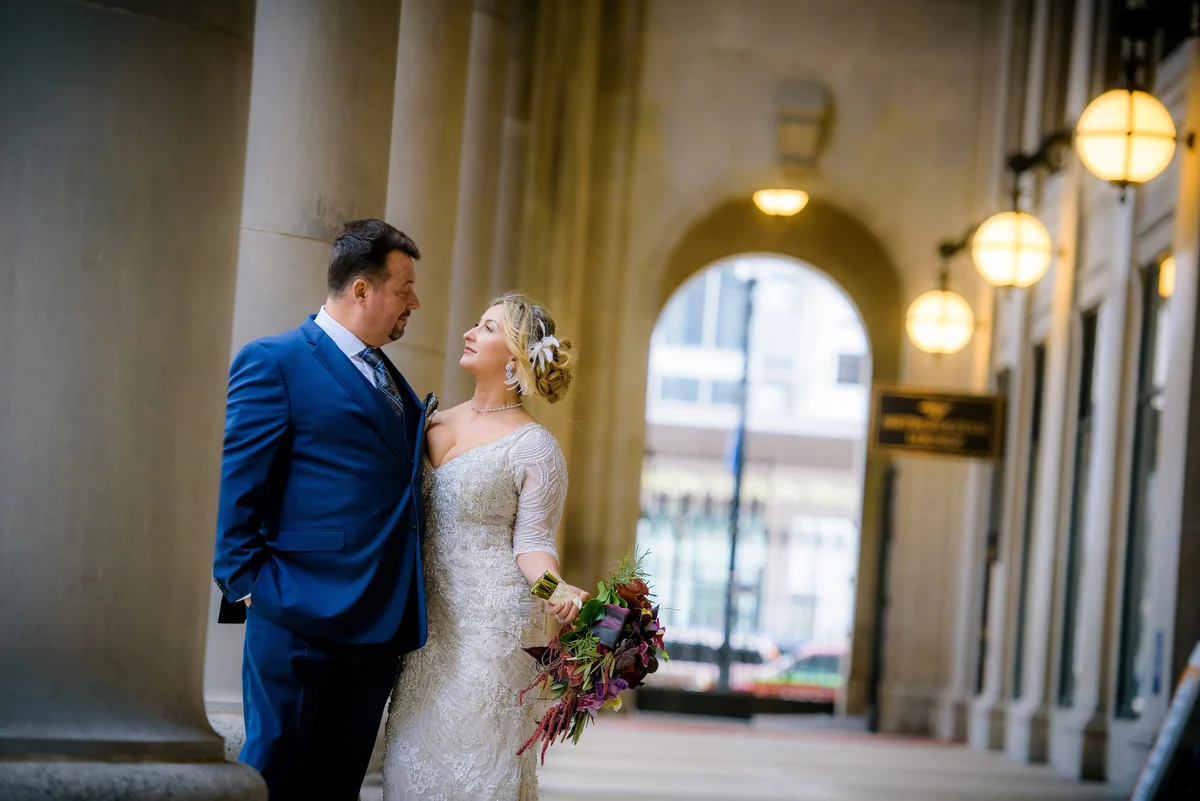 Wedding photo of the bride & groom outside Union Station Chicago. 