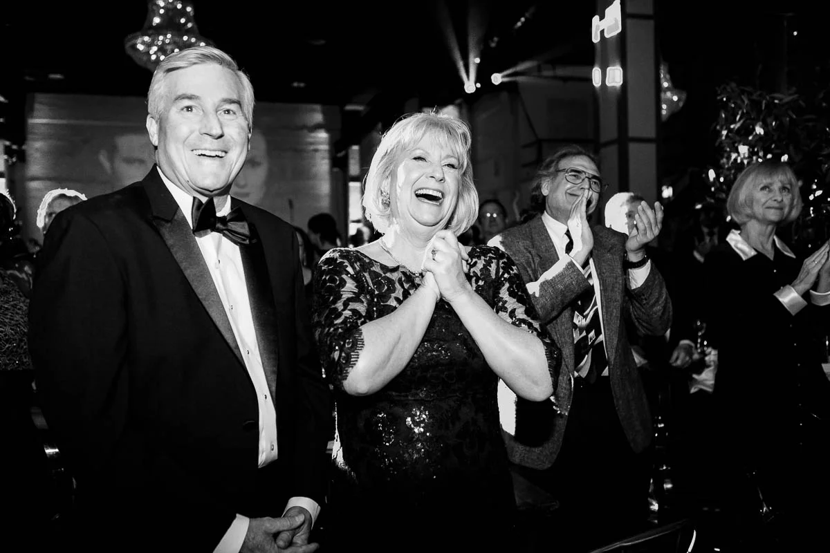 Parents of the bride react as the couple is introduced at their Moonlight Studios Chicago wedding. 