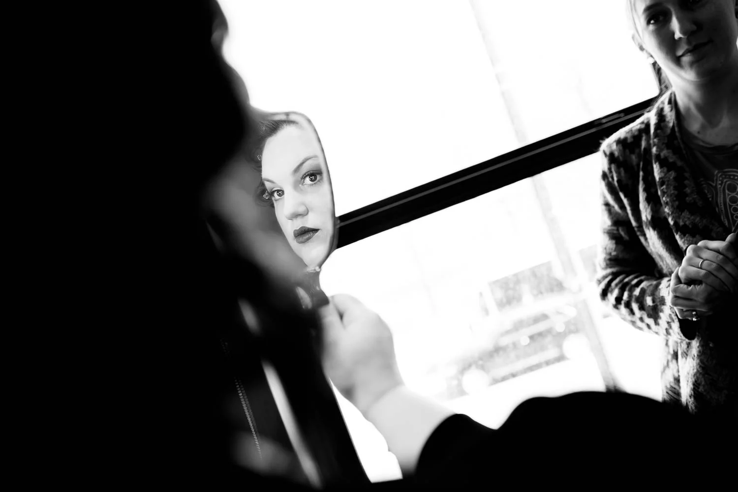 Bride gets ready at Hotel Lincoln before her Chicago wedding at Cafe Brauer. 