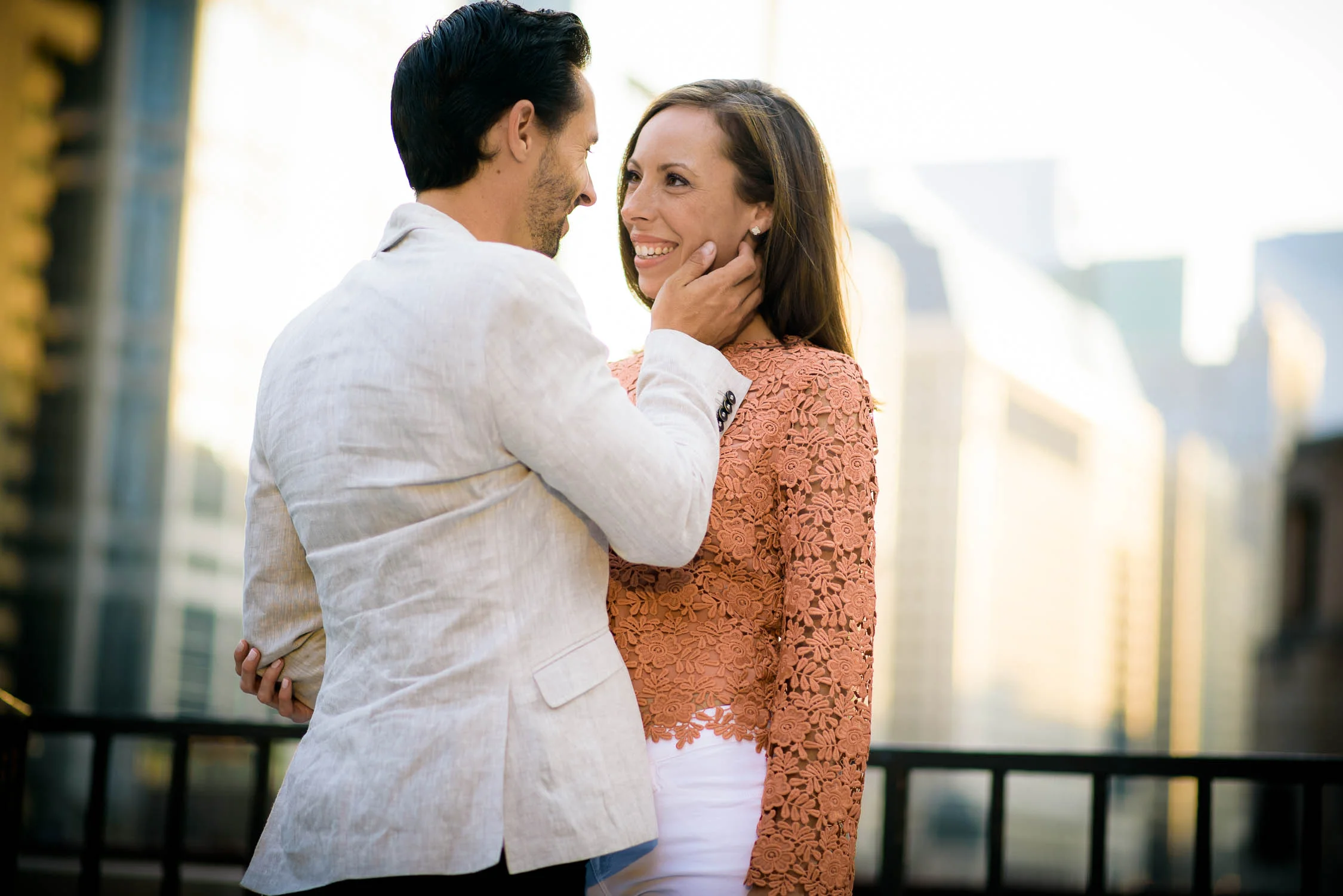 The couple embraces during their Chicago engagement session on the river. 