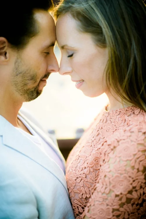 Couple in the afternoon sunlight along the Chicago river during their engagement session. 