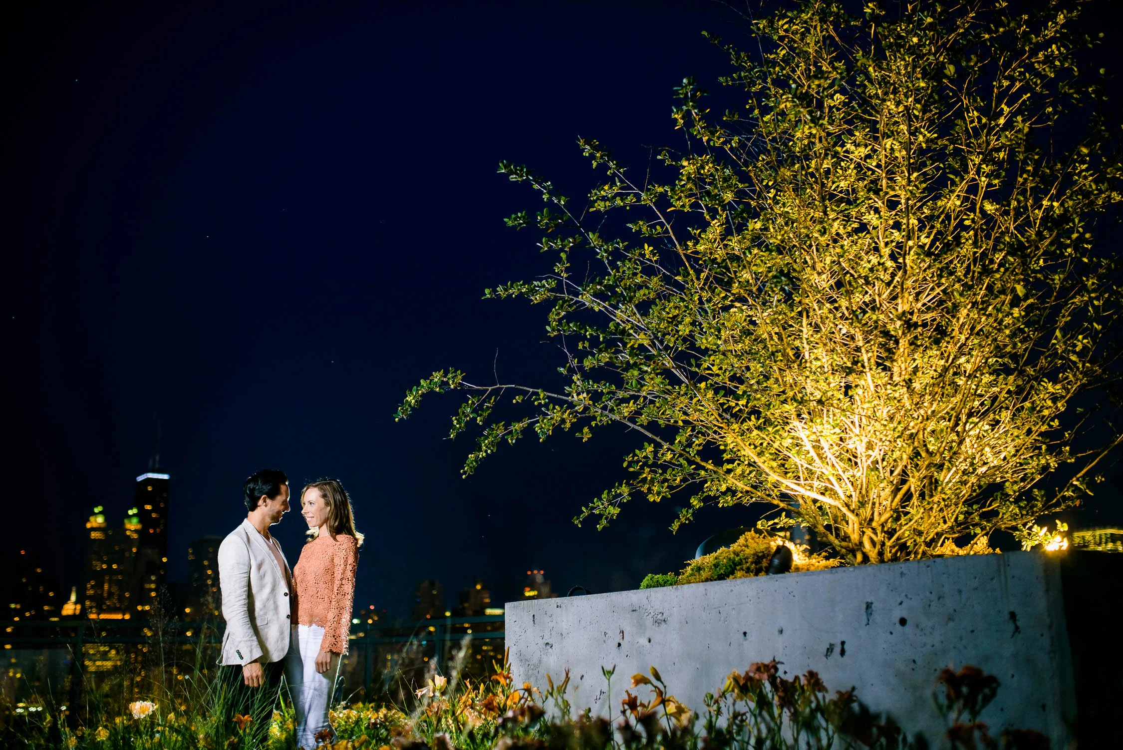 Rooftop night portrait during a Chicago engagement session. 