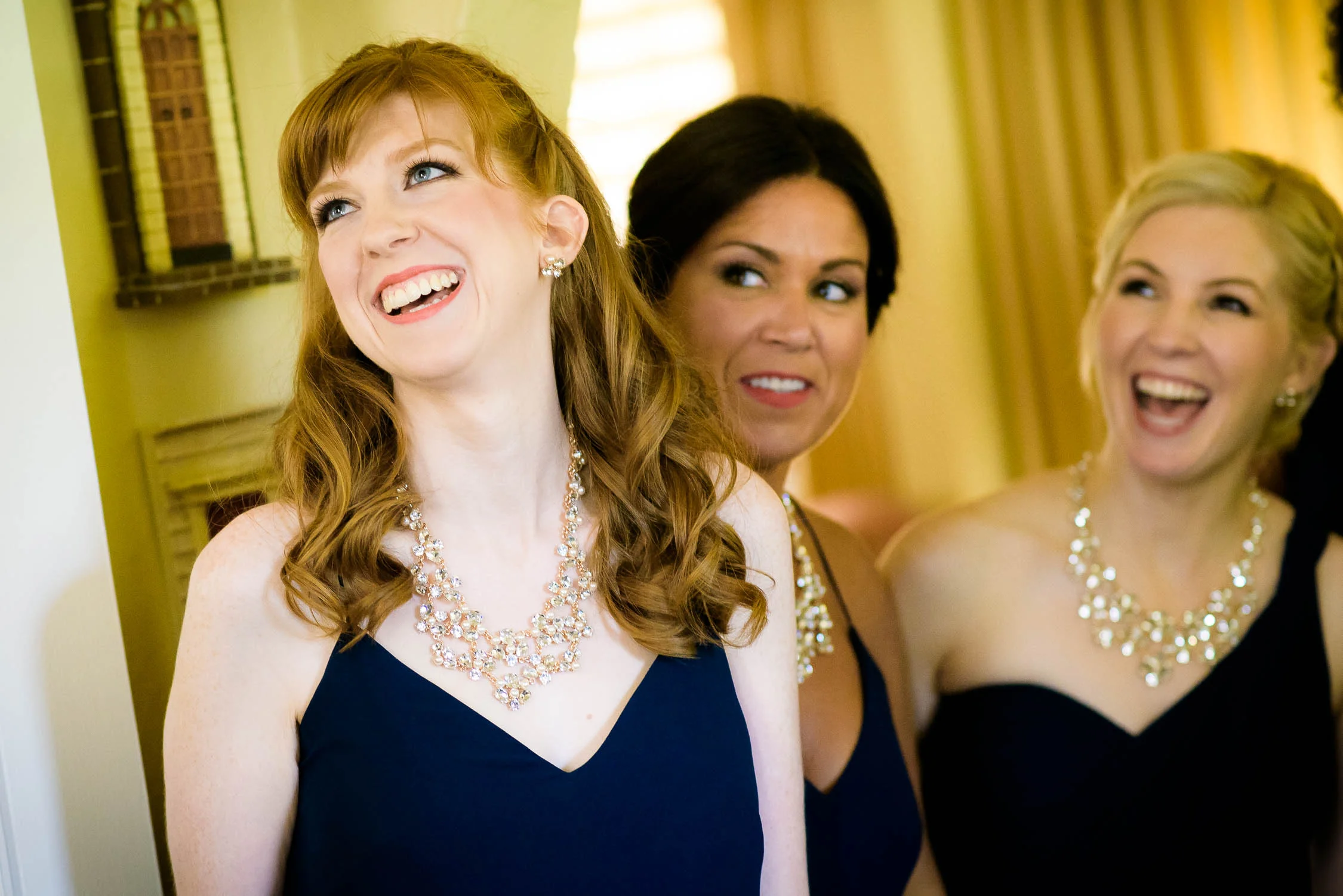 Bridesmaid see the bride for the first time during a Bridgeport Art Center wedding. 
