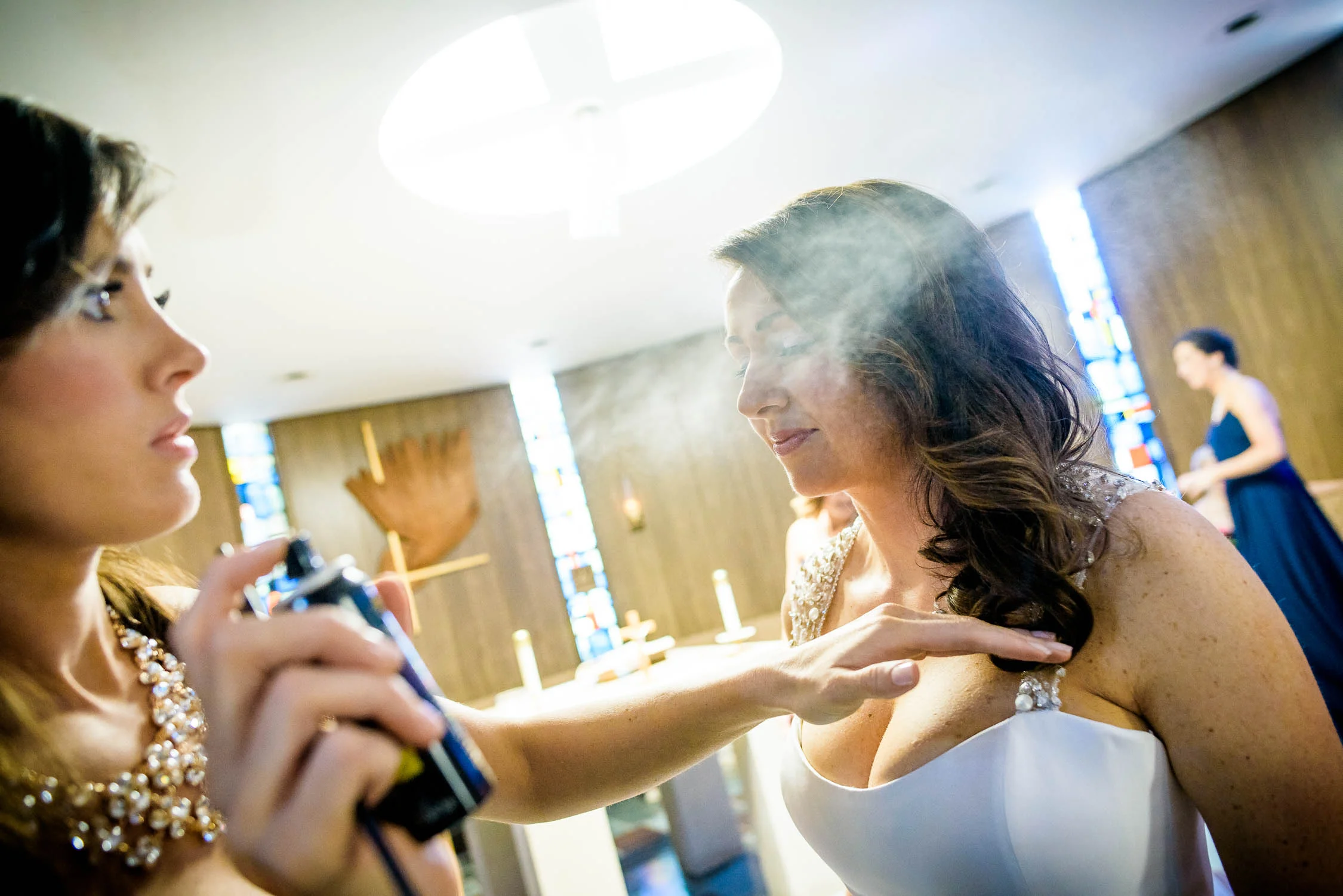 Final touch ups before a wedding ceremony at St. Barnabas in Beverly, Chicago. 