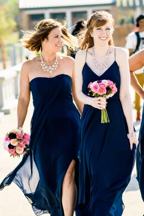 Bridesmaids walk down the 31st Street Beach before a Bridgeport Art Center wedding in Chicago. 