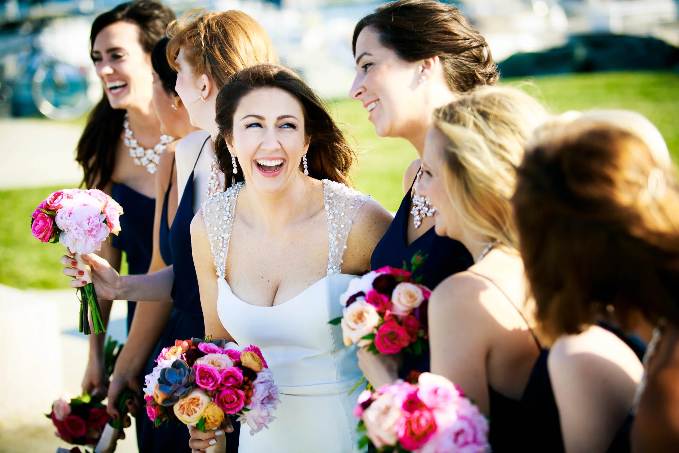 Bridesmaids share a laugh at the 31st Beach before a Bridgeport Art Center wedding in Chicago.