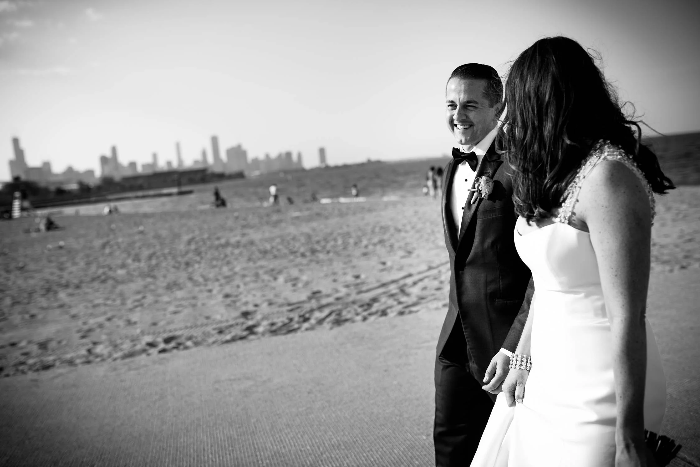 The couple takes a stroll down the 31st Street Beach on their way to their Bridgeport Art Center wedding in Chicago.